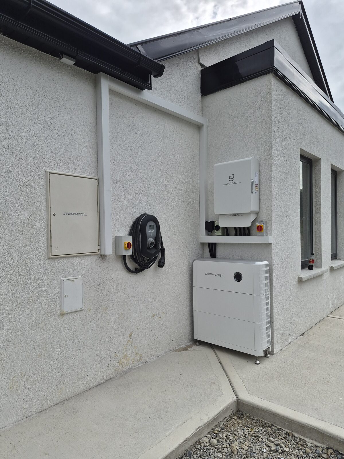 EV charge point installed on an exterior house wall