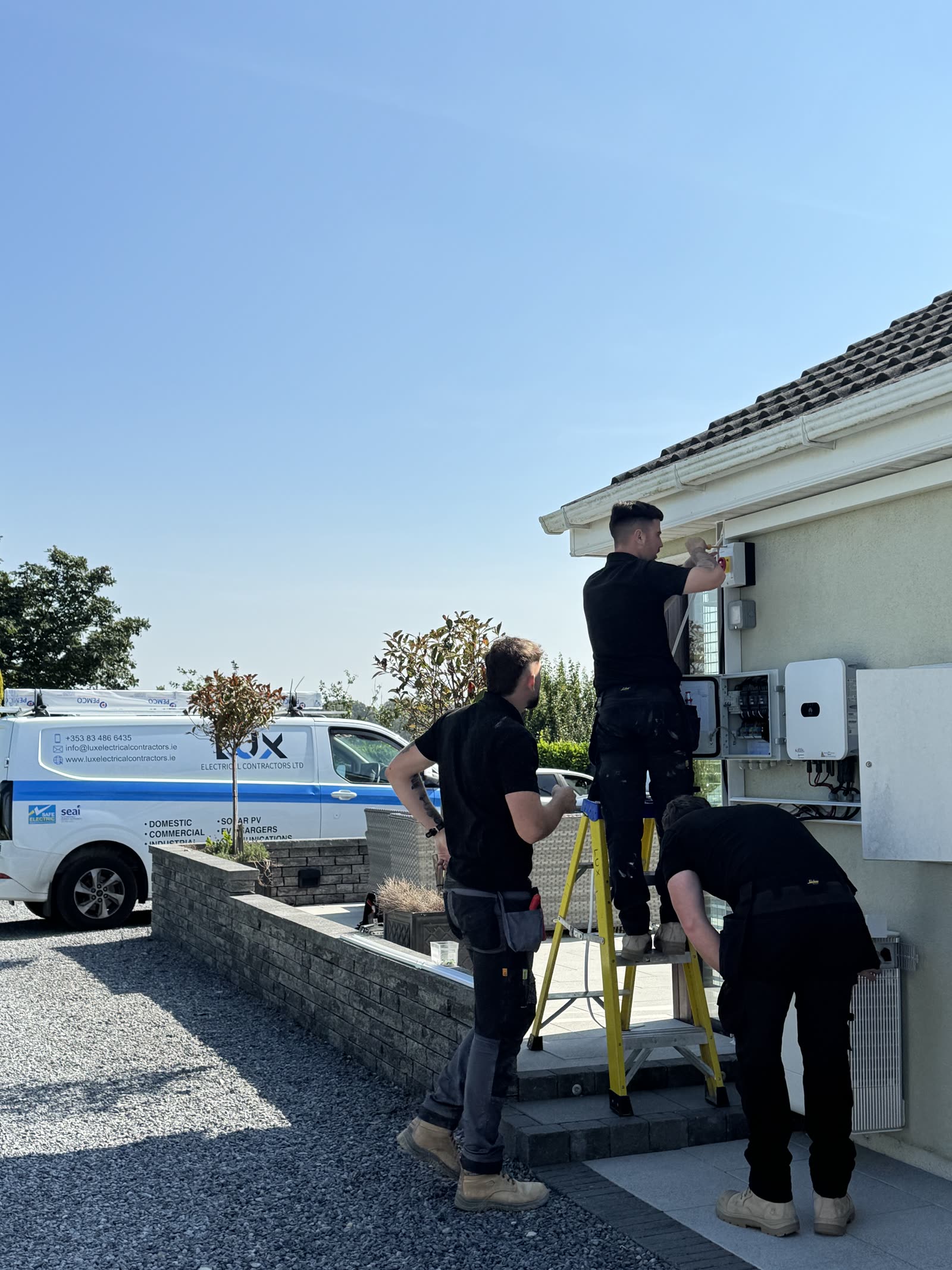 Lux team surveying a home before a solar installation